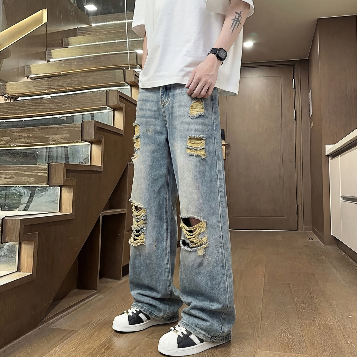 Light colored ripped jeans for men